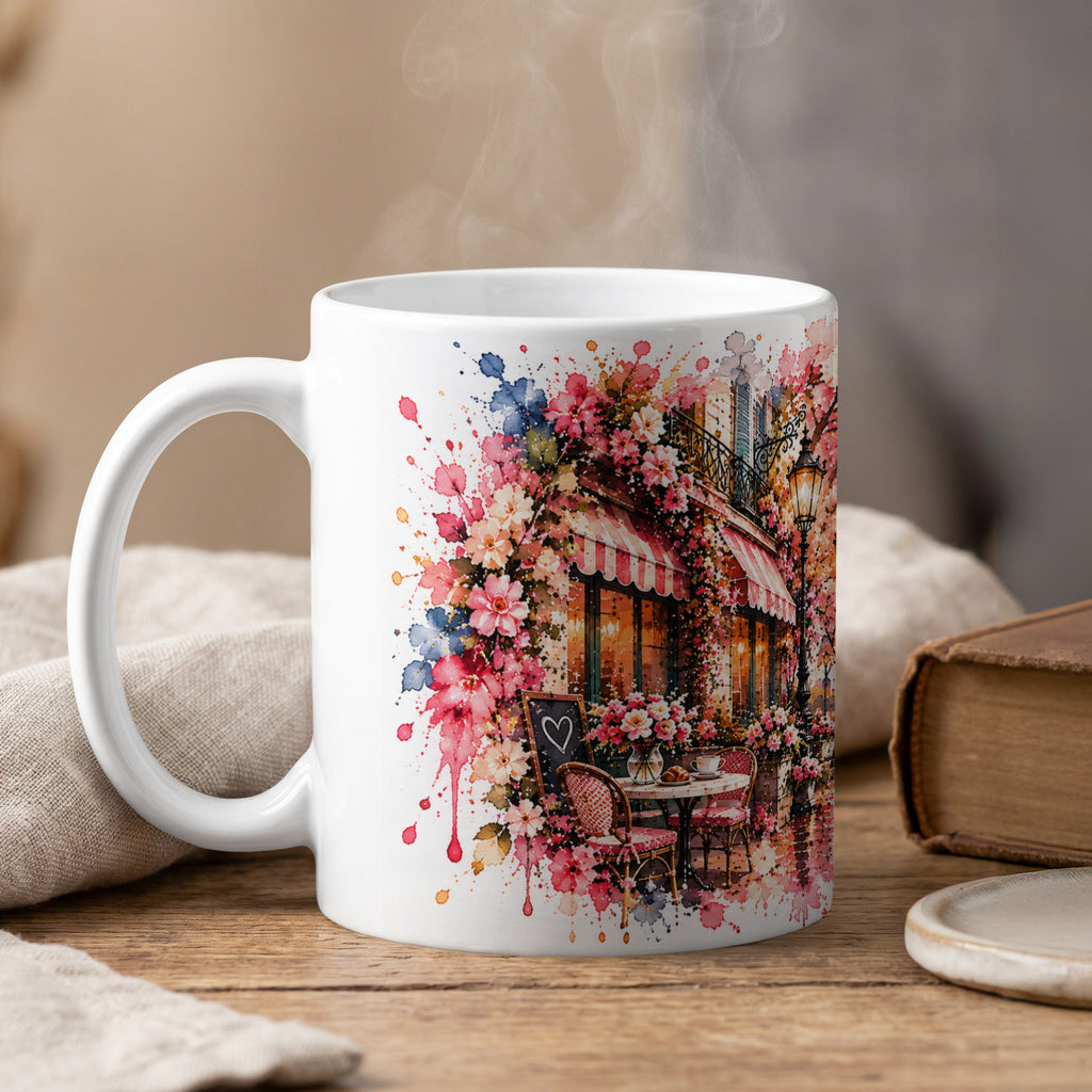 White mug with watercolor floral design of a Parisian cafe scene.